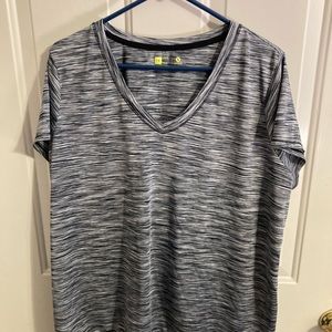 Xersion 1X semi fit black/white stripe short sleeve nylon shirt.